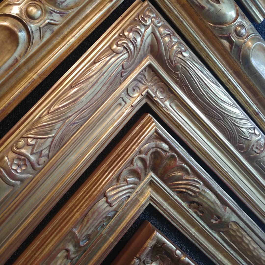 Gilded and carved picture frame details