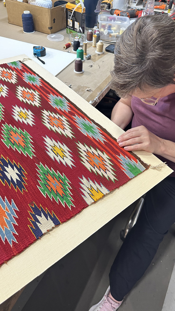 Hand mounting detail for a textile framing project